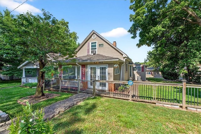4602 State Line Rd, Kansas City, KS 66103 - bungalow-style home featuring a chimney and french doors