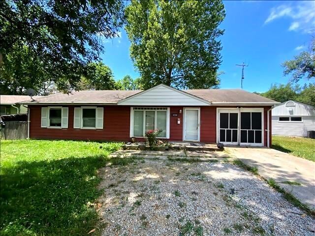 4738 Norton Cir, Kansas City, MO 64128 - single story home with a front lawn