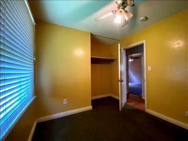 4738 Norton Cir, Kansas City, MO 64128 - unfurnished bedroom featuring a closet, carpet floors, and ceiling fan