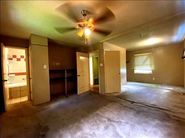 4738 Norton Cir, Kansas City, MO 64128 - unfurnished bedroom with carpet, ensuite bathroom, and ceiling fan