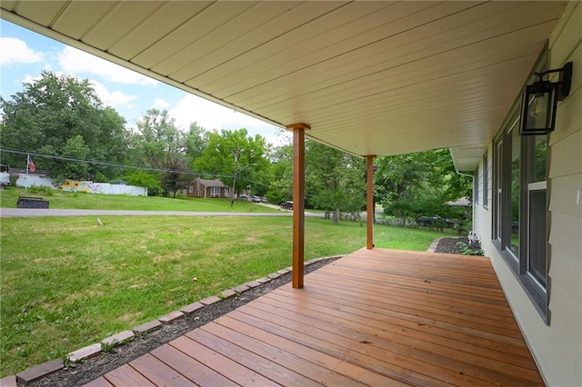 2415 E 126th St, Kansas City, MO 64146 - wooden terrace featuring a yard and view of scattered trees