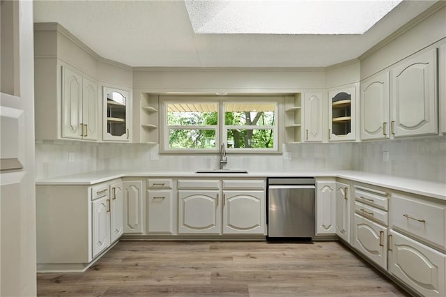 2415 E 126th St, Kansas City, MO 64146 - kitchen with dishwasher, open shelves, crown molding, tasteful backsplash, and glass insert cabinets