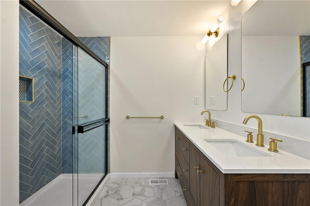 2415 E 126th St, Kansas City, MO 64146 - bathroom featuring double vanity, marble finish flooring, and a tile shower