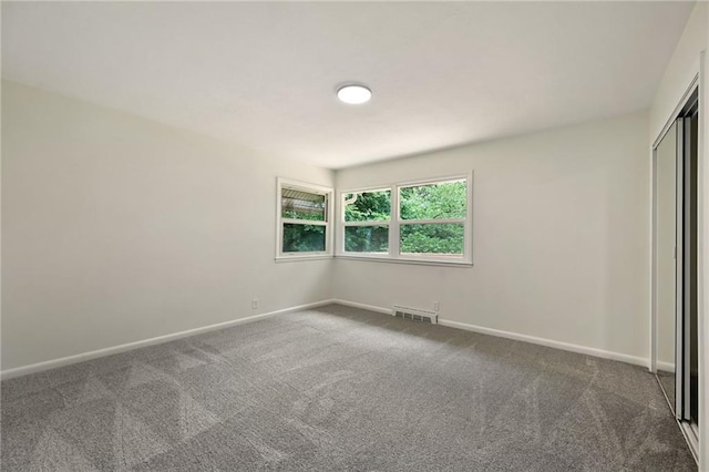 2415 E 126th St, Kansas City, MO 64146 - unfurnished bedroom featuring carpet flooring and a closet
