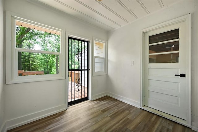 2415 E 126th St, Kansas City, MO 64146 - doorway with dark wood-style floors and baseboards