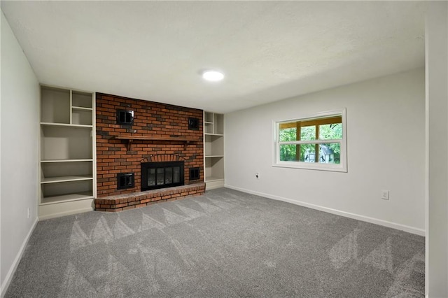 2415 E 126th St, Kansas City, MO 64146 - unfurnished living room featuring carpet floors, built in shelves, and a brick fireplace