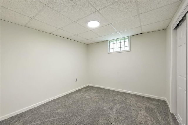 2415 E 126th St, Kansas City, MO 64146 - basement with carpet flooring and a paneled ceiling