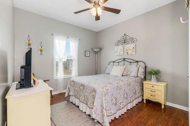 1912 Sequoia Dr, Raymore, MO 64083 - bedroom featuring dark wood finished floors and a ceiling fan
