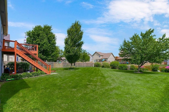 1912 Sequoia Dr, Raymore, MO 64083 - view of yard featuring stairs and a wooden deck