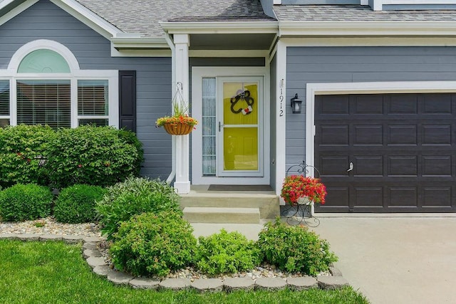 1912 Sequoia Dr, Raymore, MO 64083 - property entrance featuring roof with shingles and a garage