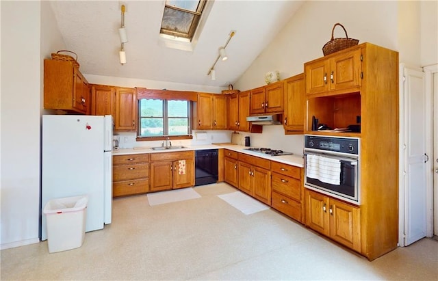 4598 N Avilla St, Reeds, MO 64859 - kitchen featuring black appliances, brown cabinets, rail lighting, light countertops, and lofted ceiling
