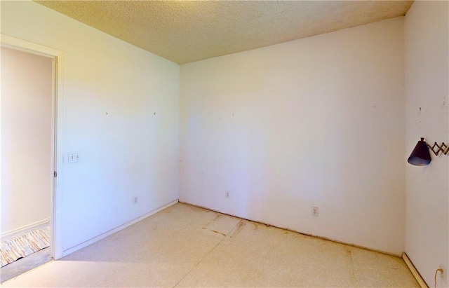 4598 N Avilla St, Reeds, MO 64859 - unfurnished room featuring a textured ceiling