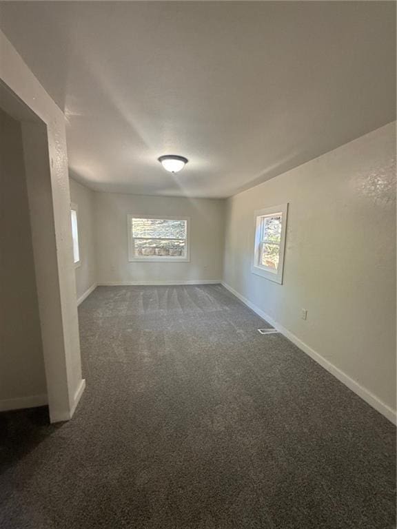 2010 N 2nd St, Saint Joseph, MO 64505 - unfurnished room with carpet and plenty of natural light
