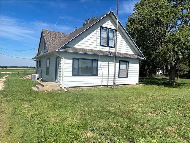 895 Cloud Rd, Salina, KS 67436 - view of home's exterior featuring roof with shingles and a lawn