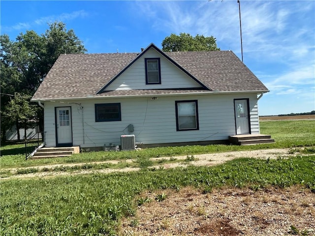 895 Cloud Rd, Salina, KS 67436 - rear view of house featuring a yard and a shingled roof