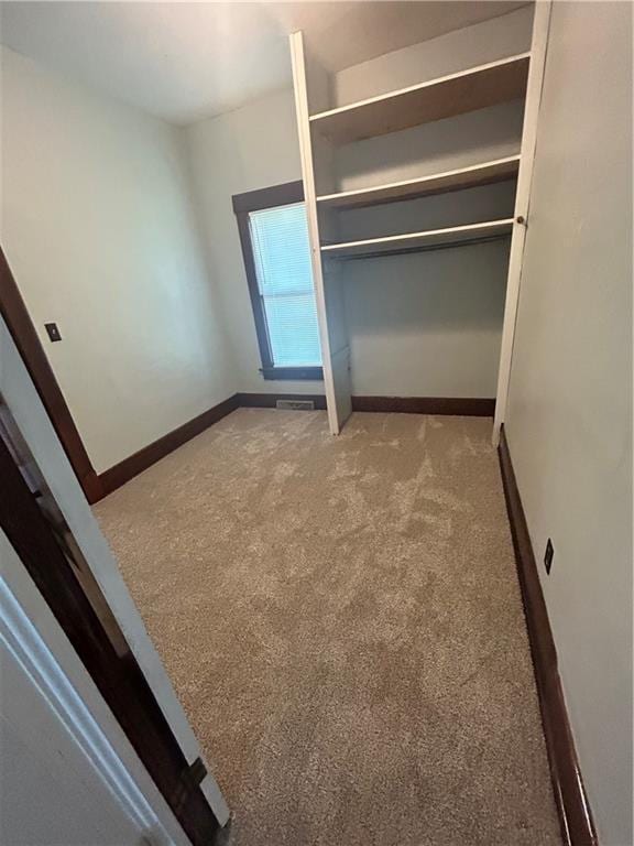 895 Cloud Rd, Salina, KS 67436 - unfurnished bedroom with carpet flooring and a closet