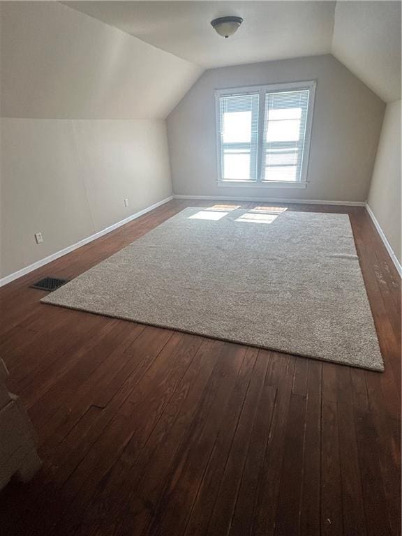 895 Cloud Rd, Salina, KS 67436 - bonus room featuring lofted ceiling and dark wood-style flooring