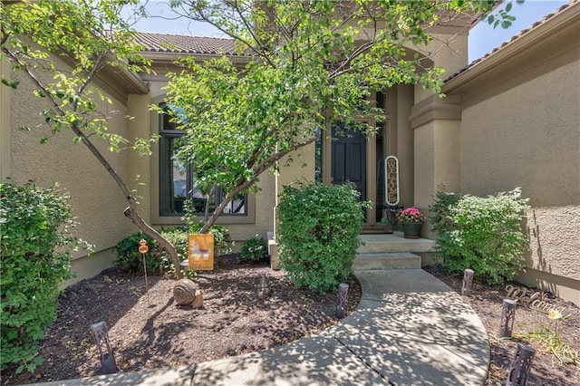 9638 Zarda Dr, Lenexa, KS 66227 - property entrance featuring stucco siding and a tiled roof