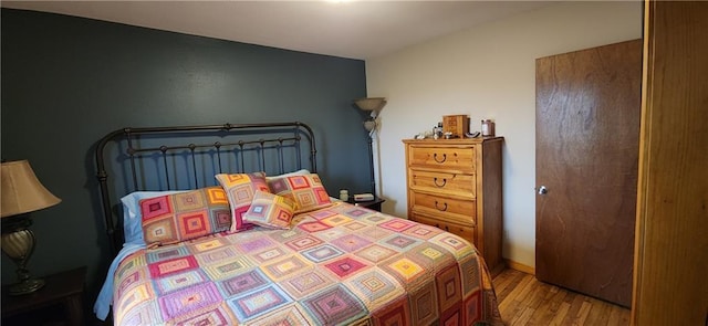 2104 County Road 4270, Independence, KS 67301 - bedroom featuring wood finished floors