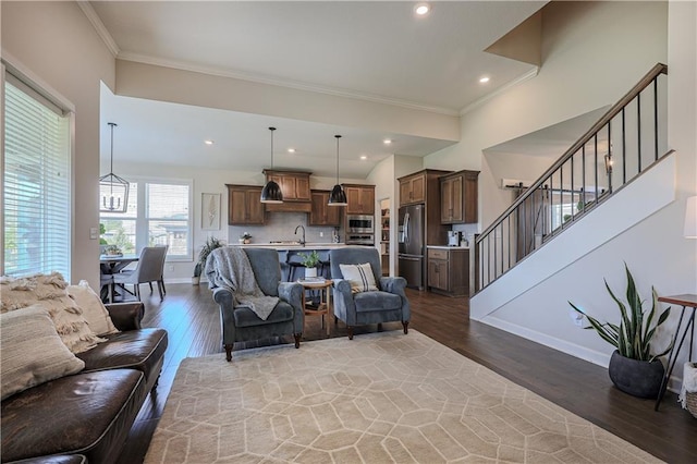 1527 SW Arbor Falls Dr, Lees Summit, MO 64082 - living room with ornamental molding, stairway, wood finished floors, and recessed lighting
