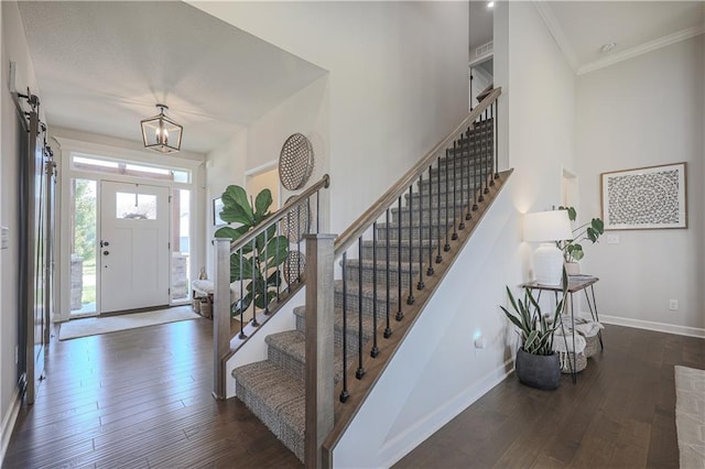 1527 SW Arbor Falls Dr, Lees Summit, MO 64082 - entryway with stairs, hardwood / wood-style flooring, ornamental molding, and a chandelier
