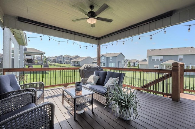 1527 SW Arbor Falls Dr, Lees Summit, MO 64082 - wooden deck with a residential view, an outdoor hangout area, a ceiling fan, and a lawn