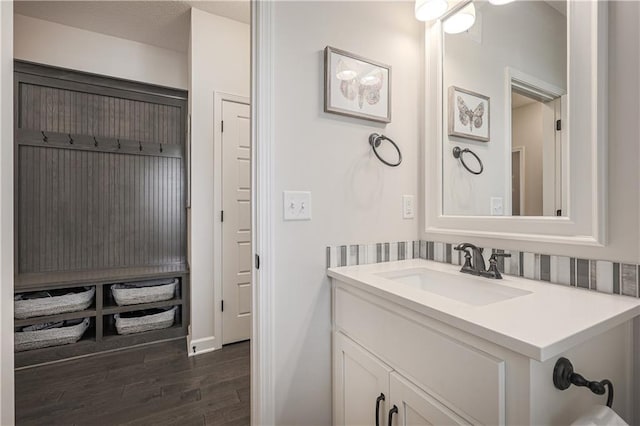 1527 SW Arbor Falls Dr, Lees Summit, MO 64082 - bathroom featuring vanity and wood finished floors