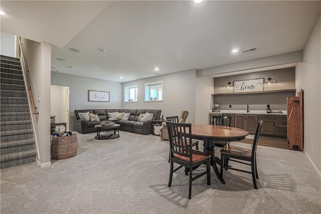 1527 SW Arbor Falls Dr, Lees Summit, MO 64082 - carpeted dining area with stairway and recessed lighting