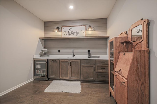 1527 SW Arbor Falls Dr, Lees Summit, MO 64082 - indoor wet bar featuring wine cooler, dark wood-style floors, and recessed lighting