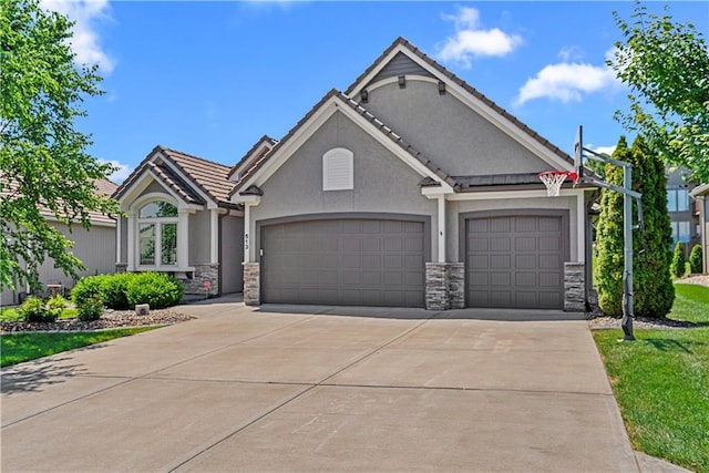 513 NE Wenonga Pl, Lees Summit, MO 64064 - ranch-style home with stone siding, an attached garage, concrete driveway, stucco siding, and a tile roof