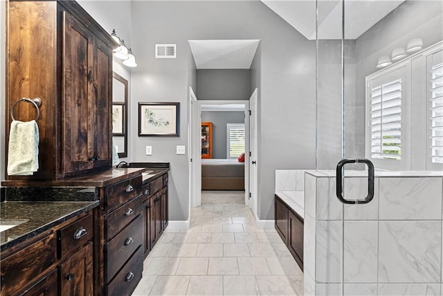 513 NE Wenonga Pl, Lees Summit, MO 64064 - full bathroom featuring marble finish flooring, double vanity, and plenty of natural light