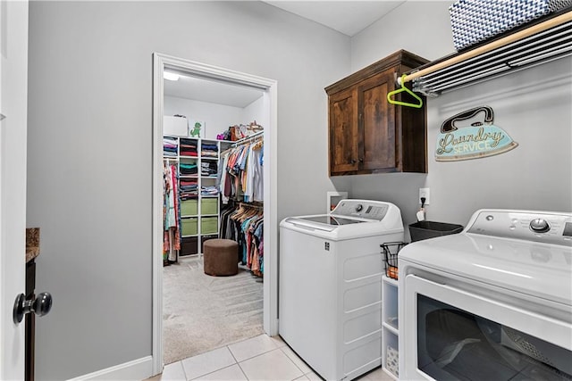 513 NE Wenonga Pl, Lees Summit, MO 64064 - laundry area with washer and clothes dryer, cabinet space, light tile patterned floors, and light carpet