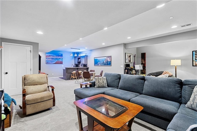 513 NE Wenonga Pl, Lees Summit, MO 64064 - living room featuring carpet floors, a bar, and recessed lighting