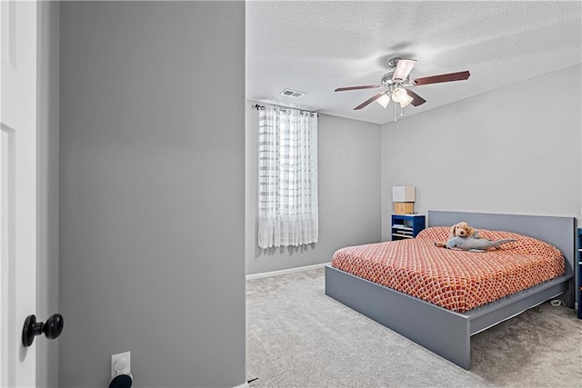 513 NE Wenonga Pl, Lees Summit, MO 64064 - carpeted bedroom with a textured ceiling and a ceiling fan