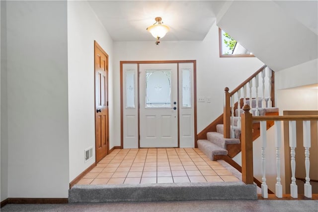 13109 W 65th St, Shawnee, KS 66216 - entryway with stairway and light tile patterned floors