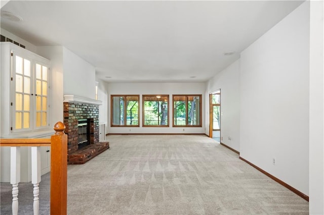 13109 W 65th St, Shawnee, KS 66216 - unfurnished living room featuring a brick fireplace and carpet floors