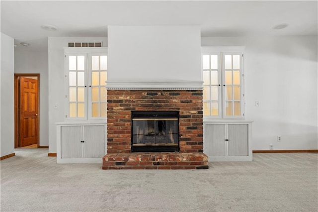 13109 W 65th St, Shawnee, KS 66216 - unfurnished living room featuring carpet flooring and a brick fireplace