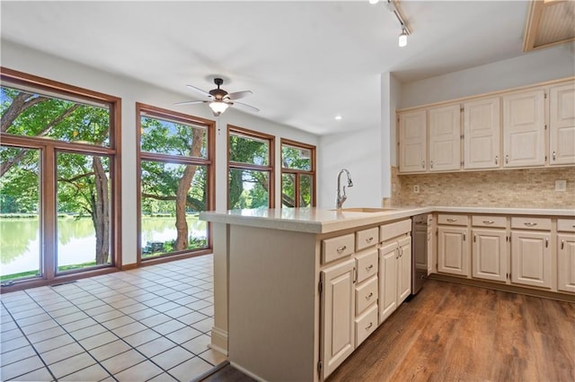 13109 W 65th St, Shawnee, KS 66216 - kitchen featuring light countertops, plenty of natural light, a ceiling fan, tasteful backsplash, and recessed lighting