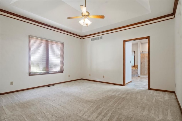 13109 W 65th St, Shawnee, KS 66216 - carpeted spare room featuring a tray ceiling, ceiling fan, and crown molding
