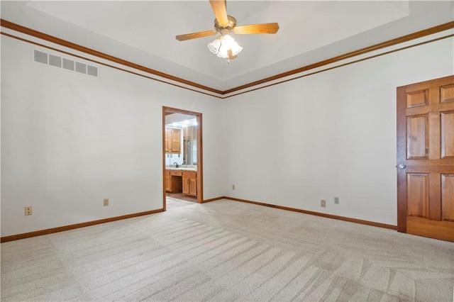 13109 W 65th St, Shawnee, KS 66216 - empty room featuring light carpet, a ceiling fan, crown molding, and a tray ceiling