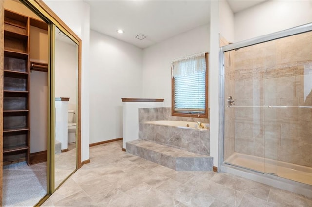 13109 W 65th St, Shawnee, KS 66216 - full bath featuring a bath, a stall shower, and recessed lighting