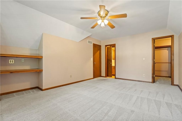 13109 W 65th St, Shawnee, KS 66216 - unfurnished living room featuring a ceiling fan, carpet floors, and vaulted ceiling