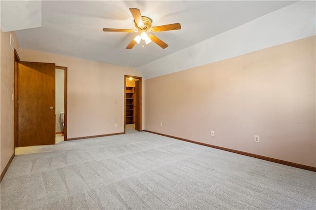 13109 W 65th St, Shawnee, KS 66216 - spare room with ceiling fan, light colored carpet, and vaulted ceiling