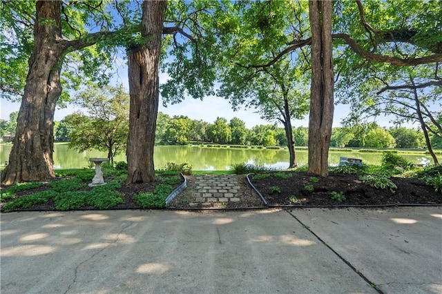 13109 W 65th St, Shawnee, KS 66216 - view of yard with a water view and view of scattered trees