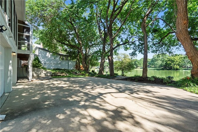13109 W 65th St, Shawnee, KS 66216 - view of patio / terrace with a water view