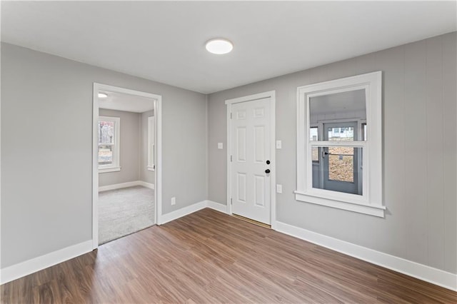 320 N Cedar Ave, Independence, MO 64053 - foyer featuring wood finished floors and plenty of natural light