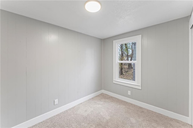 320 N Cedar Ave, Independence, MO 64053 - carpeted empty room featuring baseboards
