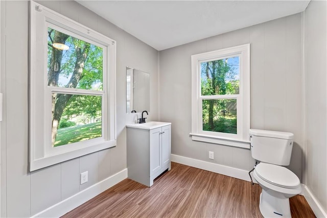 320 N Cedar Ave, Independence, MO 64053 - bathroom featuring wood finished floors and vanity