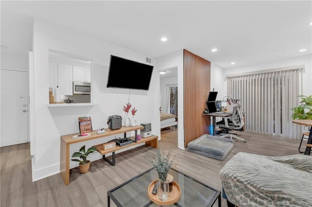 5015 Walnut St Unit A, Kansas City, MO 64112 - living room with an office area, light wood-type flooring, and recessed lighting
