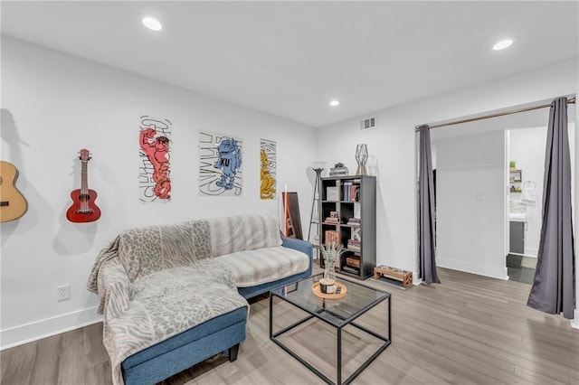 5015 Walnut St Unit A, Kansas City, MO 64112 - living area with wood finished floors and recessed lighting